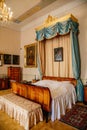 Castle interior. Bedroom with blue ÃÂanopy bed. Castle Duchcov, Czech Republic